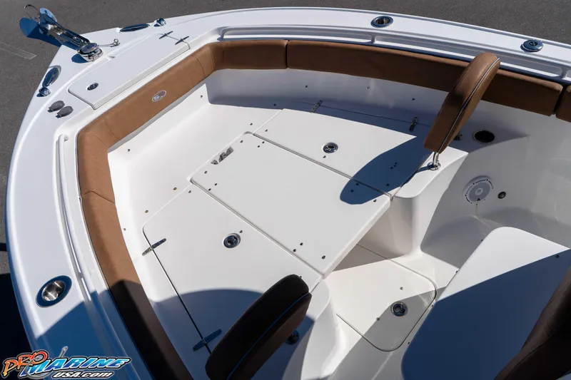 Slide: The Image of 2023 Sea Hunt Ultra 255 SE boat interior with cushioned seating and storage compartments. - 27