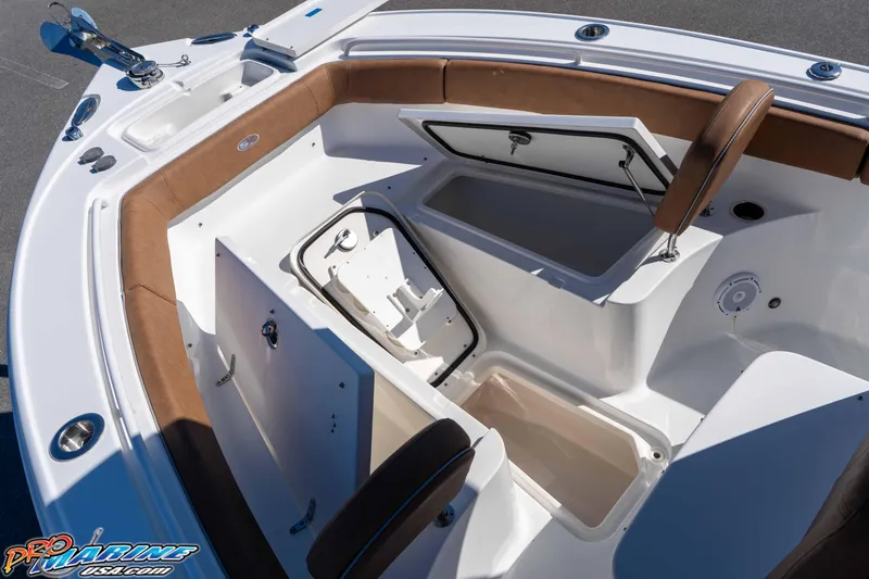 Slide: The Image of 2023 Sea Hunt Ultra 255 SE boat interior with storage compartments and seating. - 28
