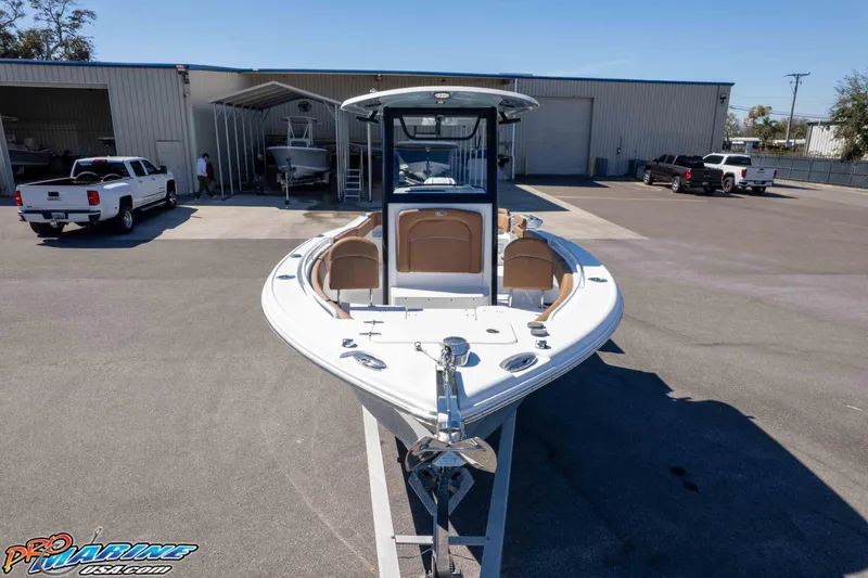 Slide: The Image of 2023 Sea Hunt Ultra 255 SE boat on trailer at a marina. - 35