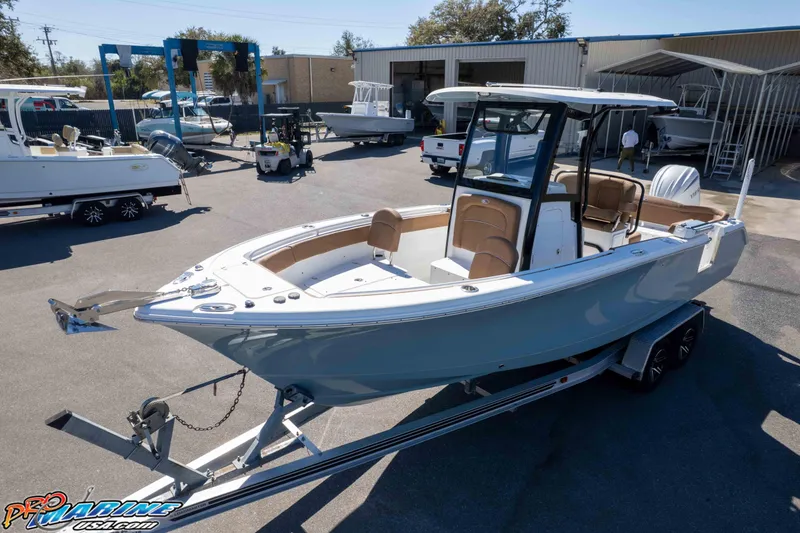 Slide: The Image of 2023 Sea Hunt Ultra 255 SE boat on trailer at dealership. - 37
