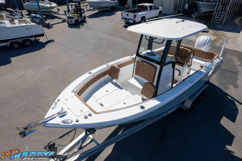 Slide: The Image of 2023 Sea Hunt Ultra 255 SE boat on trailer in marina setting. - 38