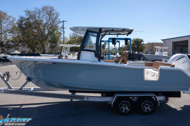 Slide: The Image of 2023 Sea Hunt Ultra 255 SE boat on trailer, parked outdoors. - 39