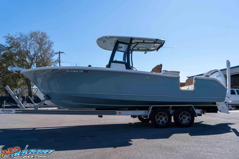 Slide: The Image of 2023 Sea Hunt Ultra 255 SE boat on trailer, side view, outdoors. - 4