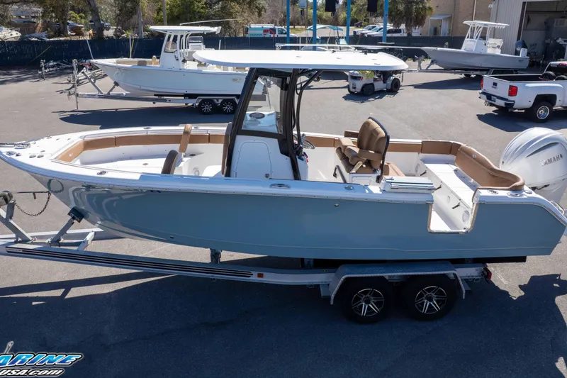 Slide: The Image of 2023 Sea Hunt Ultra 255 SE boat on trailer, featuring sleek design and spacious seating. - 40