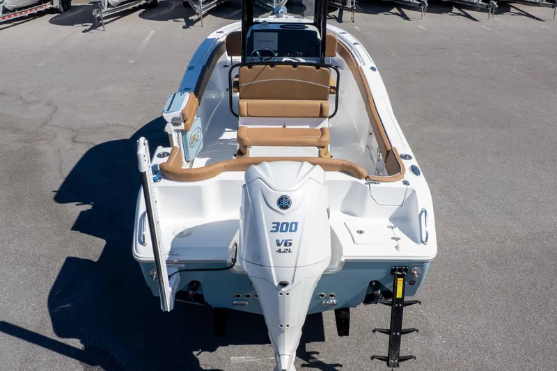 Slide: The Image of 2023 Sea Hunt Ultra 255 SE boat with Yamaha 300 V6 engine, docked on pavement. - 45