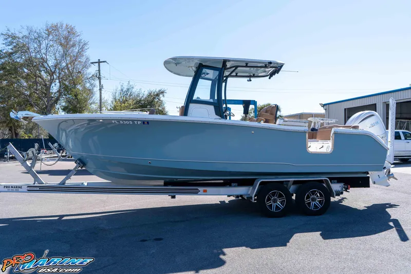 Slide: The Image of 2023 Sea Hunt Ultra 255 SE boat on trailer, parked outdoors. - 5