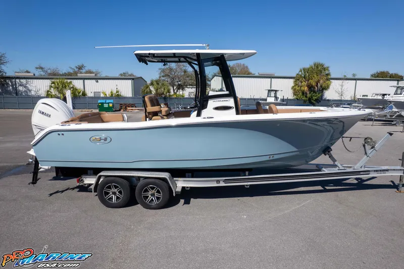 Slide: The Image of 2023 Sea Hunt Ultra 255 SE boat on trailer, side view, outdoors. - 50