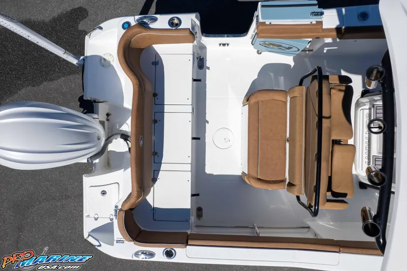 Slide: The Image of 2023 Sea Hunt Ultra 255 SE boat interior with tan seating and white deck. - 53