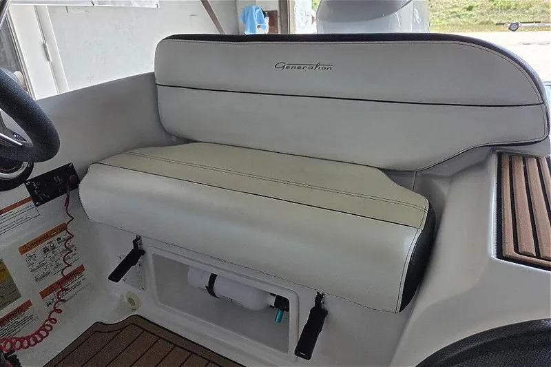 Slide: The Image of 2021 Walker Bay Generation 360 boat interior with Tohatsu 50HP, featuring cushioned seating. - 5
