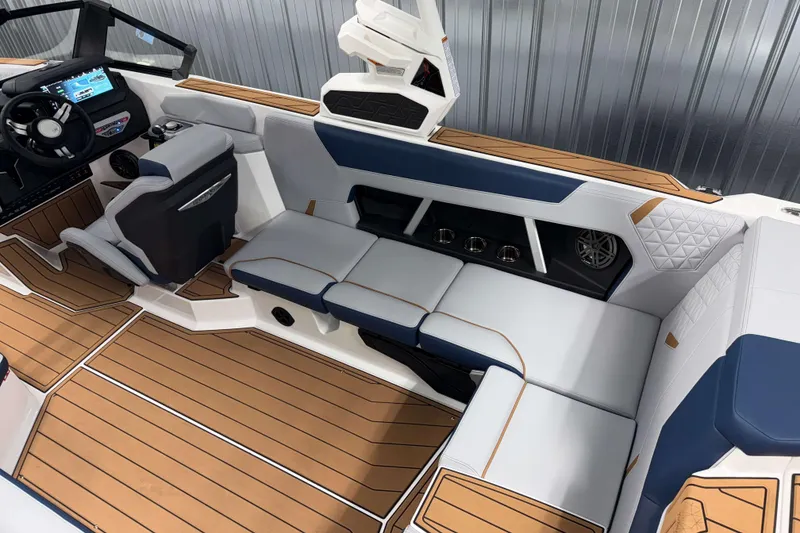 Slide: The Image of 2026 Nautique Super Air Nautique GS22 interior with luxurious seating and modern dashboard. - 10