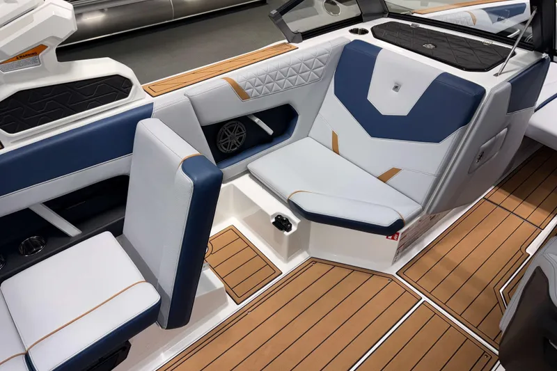 Slide: The Image of 2026 Nautique Super Air Nautique GS22 interior with stylish seating and teak flooring. - 15