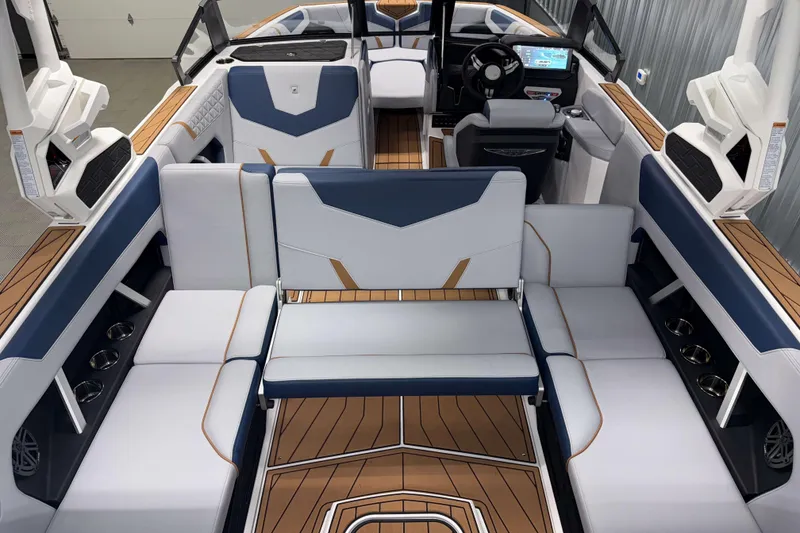 Slide: The Image of 2026 Nautique Super Air Nautique GS22 interior with luxurious seating and modern dashboard. - 16