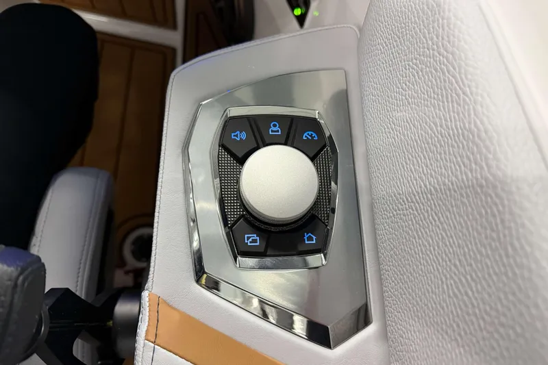 Slide: The Image of Control panel of 2026 Nautique Super Air Nautique GS22 boat with buttons and dial. - 22