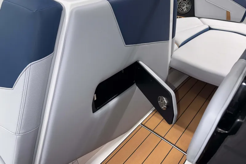 Slide: The Image of 2026 Nautique Super Air Nautique GS22 interior with sleek seating and storage compartment. - 24