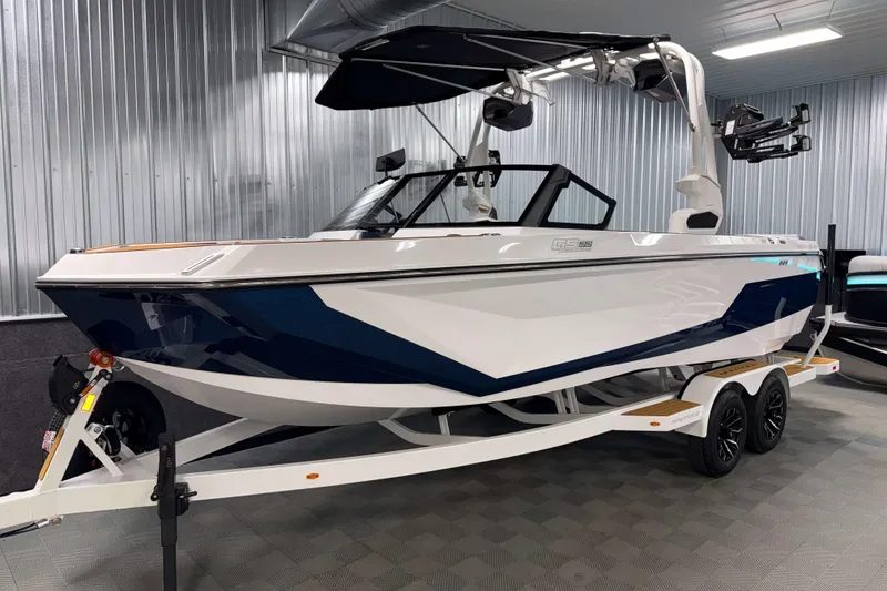 Slide: The Image of 2026 Nautique Super Air Nautique GS22 boat on trailer in showroom. - 32