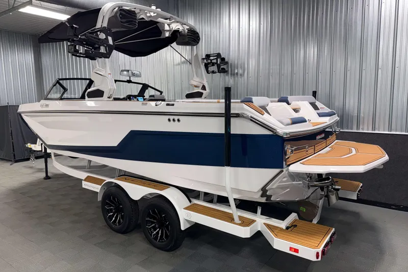 Slide: The Image of 2026 Nautique Super Air Nautique GS22 boat on trailer in a garage. - 35