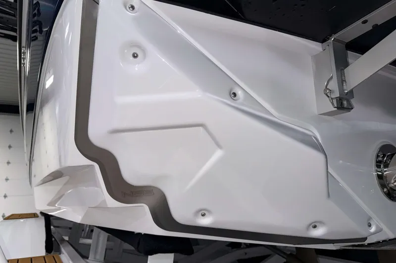 Slide: The Image of 2026 Nautique Super Air Nautique GS22 boat hull detail in showroom. - 39