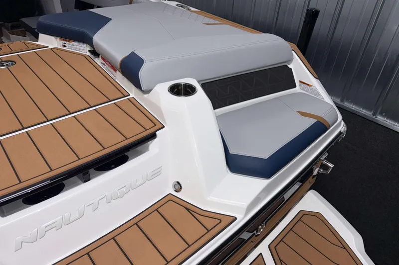 Slide: The Image of 2026 Nautique Super Air Nautique GS22 boat with sleek seating and teak-style decking. - 5