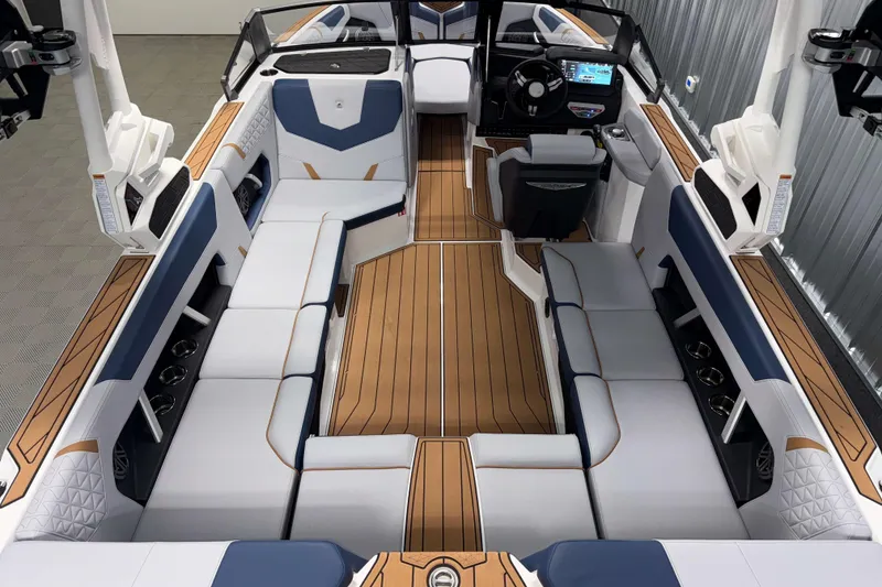 Slide: The Image of 2026 Nautique Super Air Nautique GS22 interior with luxurious seating and modern dashboard. - 8