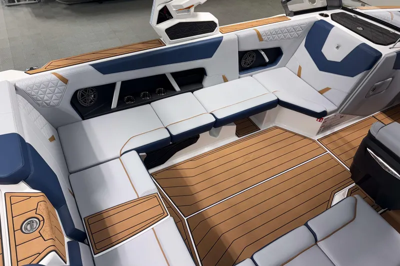 Slide: The Image of 2026 Nautique Super Air Nautique GS22 interior with luxurious seating and teak-style flooring. - 9