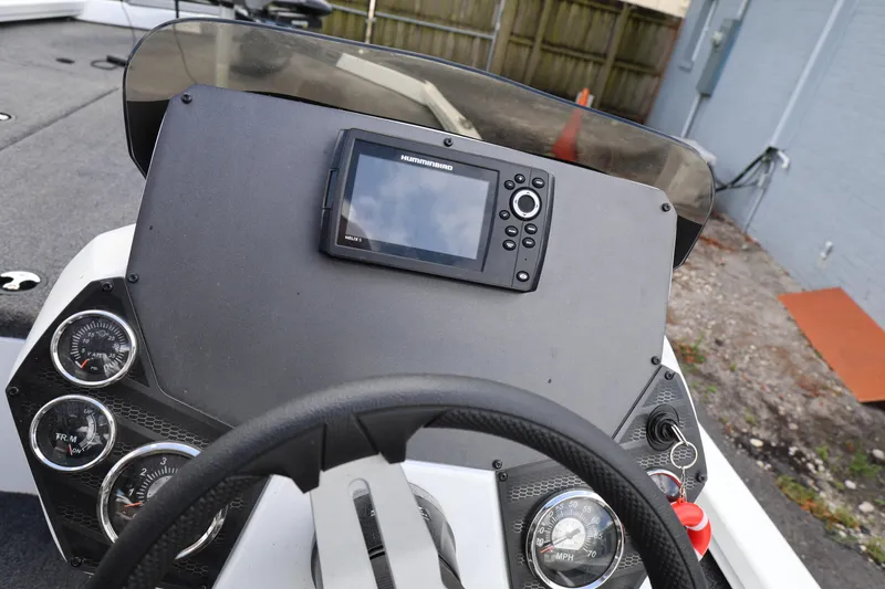 Slide: The Image of 2023 Vexus AVX189 boat dashboard with gauges and a Humminbird fish finder. - 11