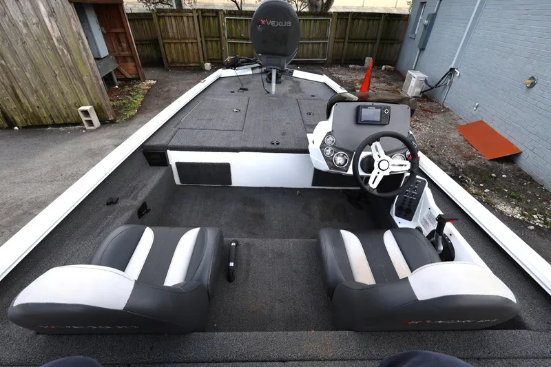 Slide: The Image of 2023 Vexus AVX189 boat interior with steering console and seating. - 8