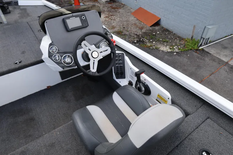 Slide: The Image of 2023 Vexus AVX189 boat cockpit with steering wheel and control panel. - 9