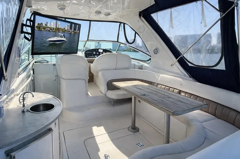 Slide: The Image of Luxurious interior of 2005 Four Winns 378 Vista yacht with seating and TV. - 10
