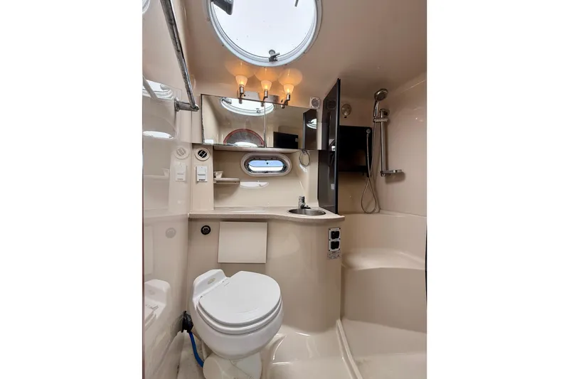 Slide: The Image of 2005 Four Winns 378 Vista yacht bathroom with modern fixtures and circular window. - 14