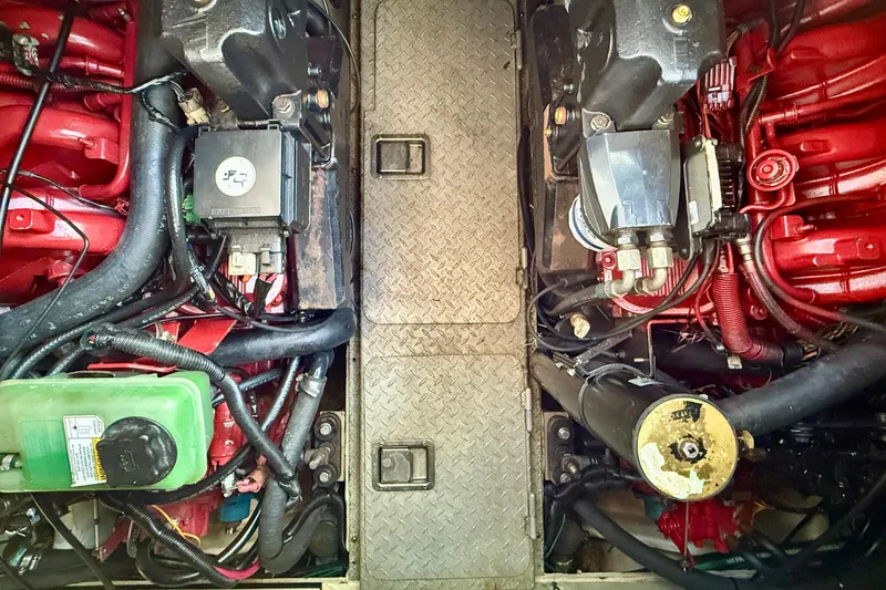 Slide: The Image of Engine compartment of a 2005 Four Winns 378 Vista boat, showcasing mechanical components. - 21