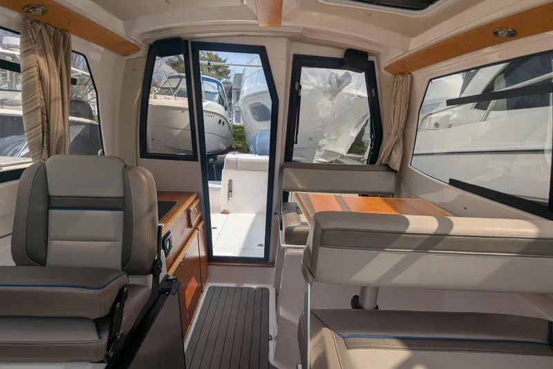 Slide: The Image of Interior of 2020 Cutwater C-24 Coupe boat with seating and table. - 10