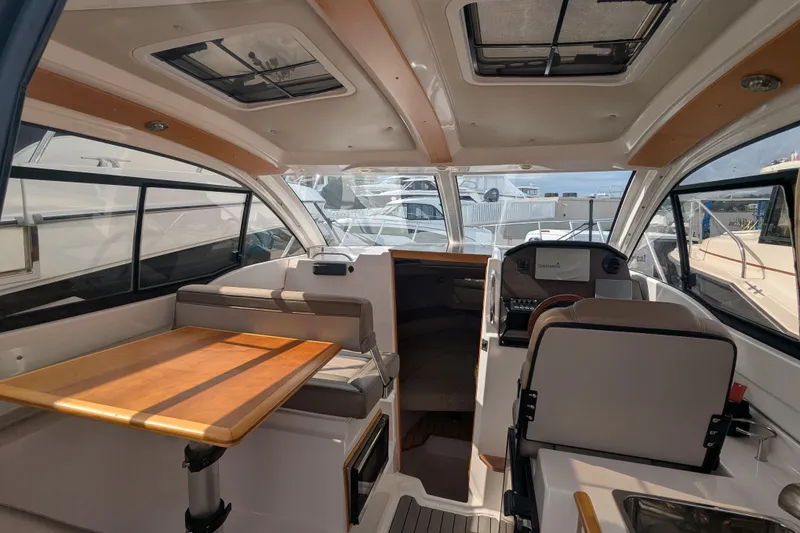 Slide: The Image of Interior of 2020 Cutwater C-24 Coupe boat with seating and helm station. - 4