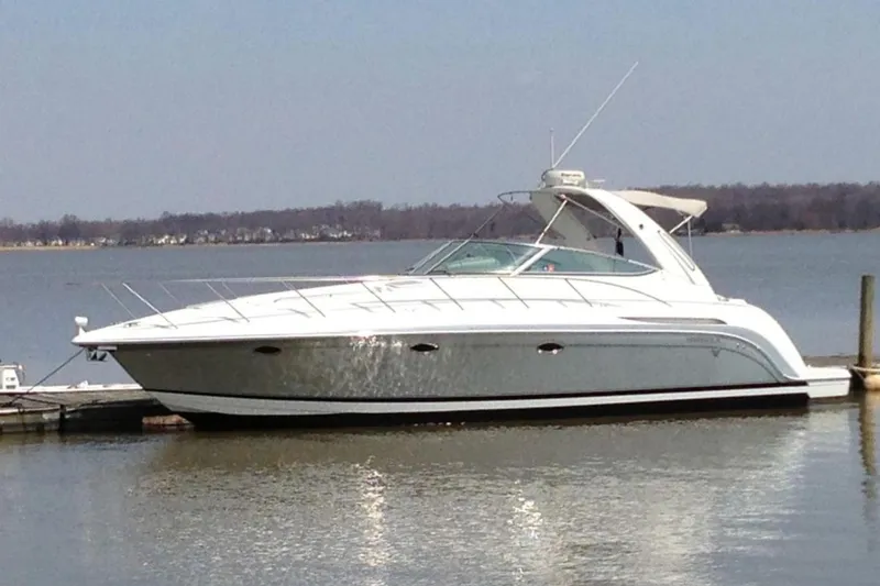 The Image of 2004 Formula 37 Performance Cruiser docked on calm water. - 0