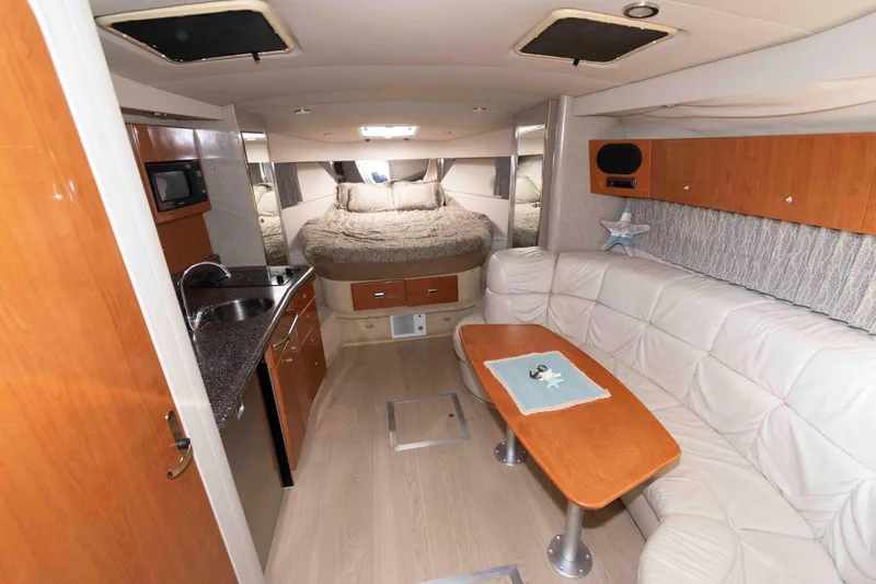 Slide: The Image of Interior of 2004 Formula 37 Performance Cruiser with kitchen, seating, and bed. - 11