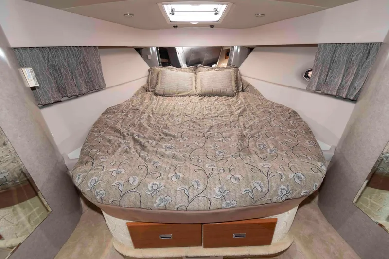 Slide: The Image of Luxurious cabin interior of a 2004 Formula 37 Performance Cruiser with elegant bedding. - 14