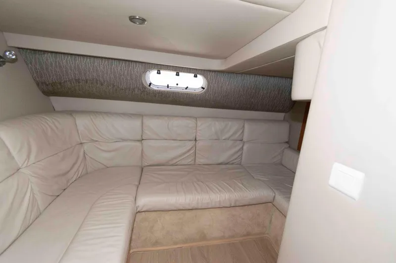 Slide: The Image of Interior of 2004 Formula 37 Performance Cruiser with plush seating and porthole window. - 15