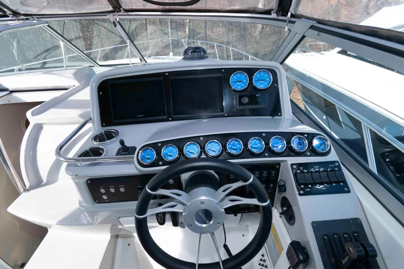 Slide: The Image of Cockpit of 2004 Formula 37 Performance Cruiser with gauges and steering wheel. - 8