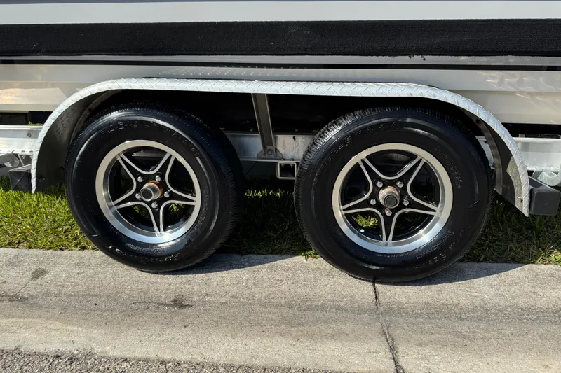 Slide: The Image of 2023 Carolina Skiff 21 SWS boat hull on trailer, side view. - 11