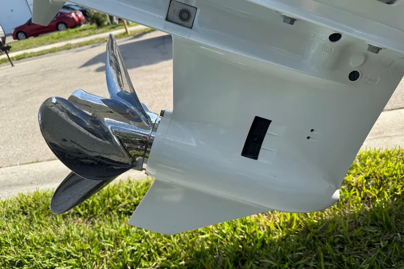 Slide: The Image of Outboard motor on 2023 Carolina Skiff 21 SWS, featuring Suzuki four-stroke engine. - 16