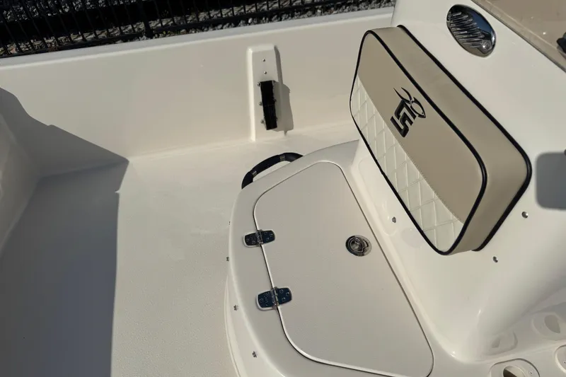 Slide: The Image of 2023 Carolina Skiff 21 SWS dashboard with Simrad display and control panel. - 28
