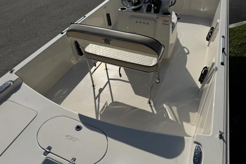 Slide: The Image of Open storage compartment in 2023 Carolina Skiff 21 SWS boat. - 32