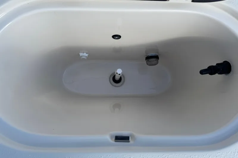 Slide: The Image of 2023 Carolina Skiff 21 SWS boat detail with chrome hardware and textured surface. - 38