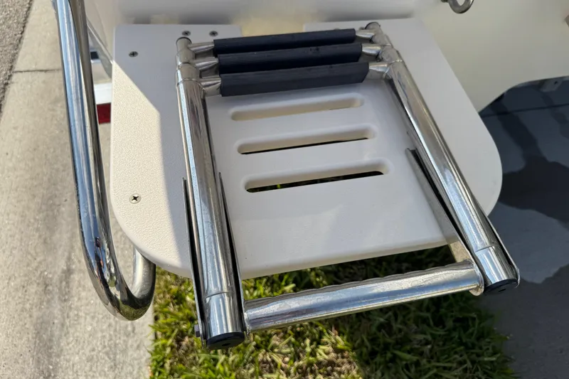 Slide: The Image of 2023 Carolina Skiff 21 SWS livewell interior with drain and fittings. - 40