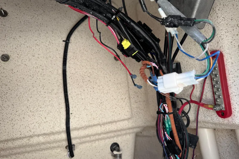 Slide: The Image of Wiring and connections inside a 2023 Carolina Skiff 21 SWS boat. - 44