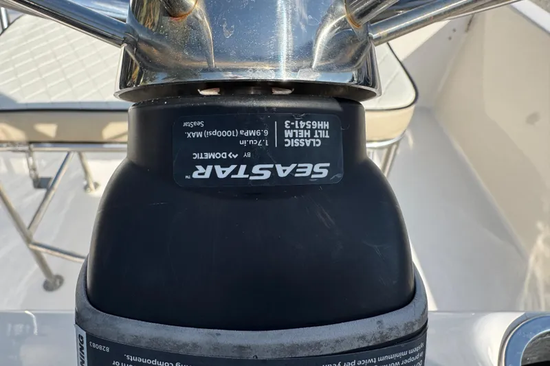 Slide: The Image of 2023 Carolina Skiff 21 SWS interior detail with rod holders and drainage system. - 48