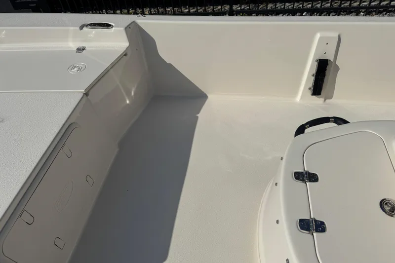 Slide: The Image of Close-up of a 2023 Carolina Skiff 21 SWS boat control panel with Suzuki logo. - 49