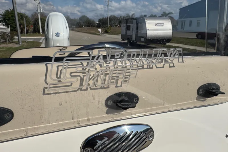 Slide: The Image of Close-up of a 2023 Carolina Skiff 21 SWS steering wheel and SeaStar helm. - 50
