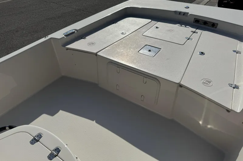 Slide: The Image of 2023 Carolina Skiff 21 SWS boat interior with storage compartments and seating area. - 51