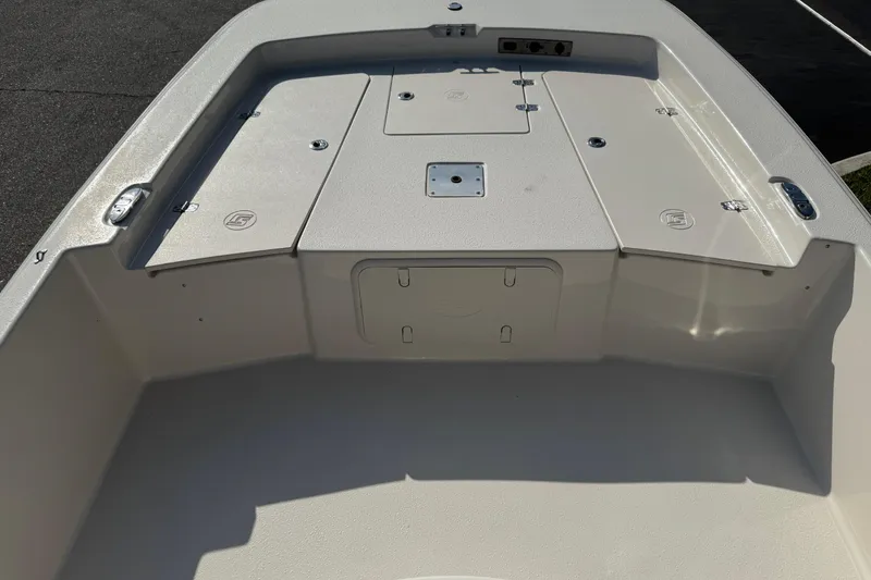 Slide: The Image of Control panel of 2023 Carolina Skiff 21 SWS with trim switch and 12V outlet. - 55