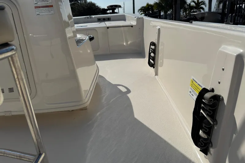 Slide: The Image of 2023 Carolina Skiff 21 SWS capacity label: 10 persons, 1442 pounds, 150 horsepower. - 56